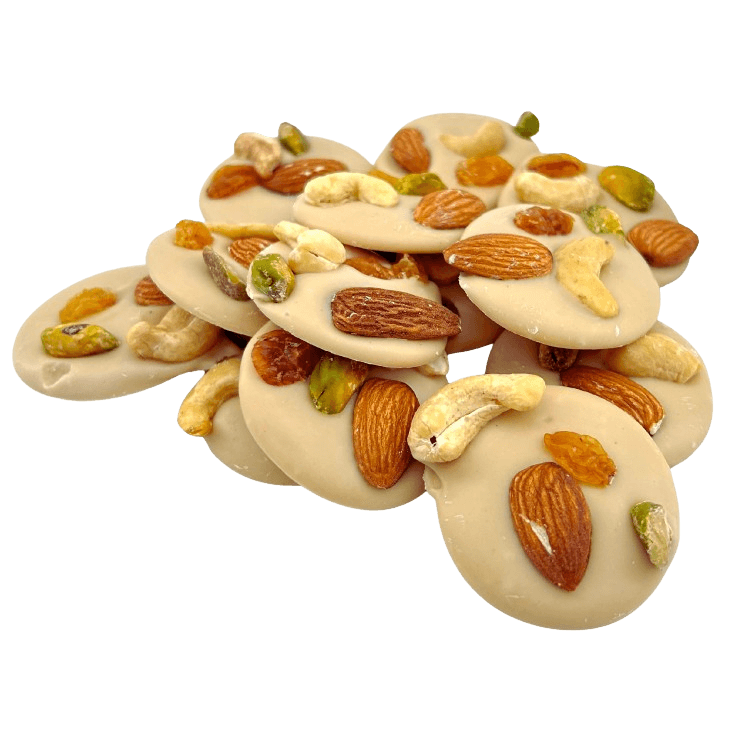 White chocolate mendiants with pistachio, almond, raisin and cashew chunks