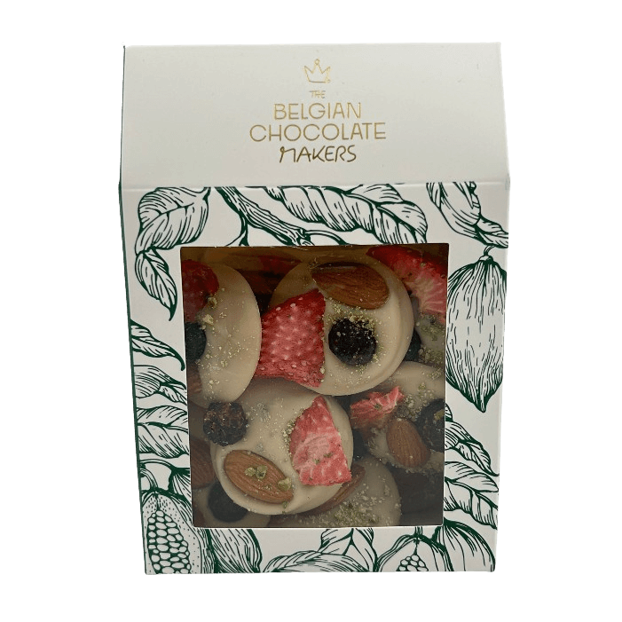 White chocolate mendiants with pistachio, almond, strawberry and blackcurrant chunks