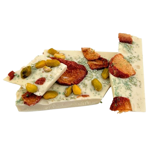 White chocolate broken bars with strawberries and pistachios