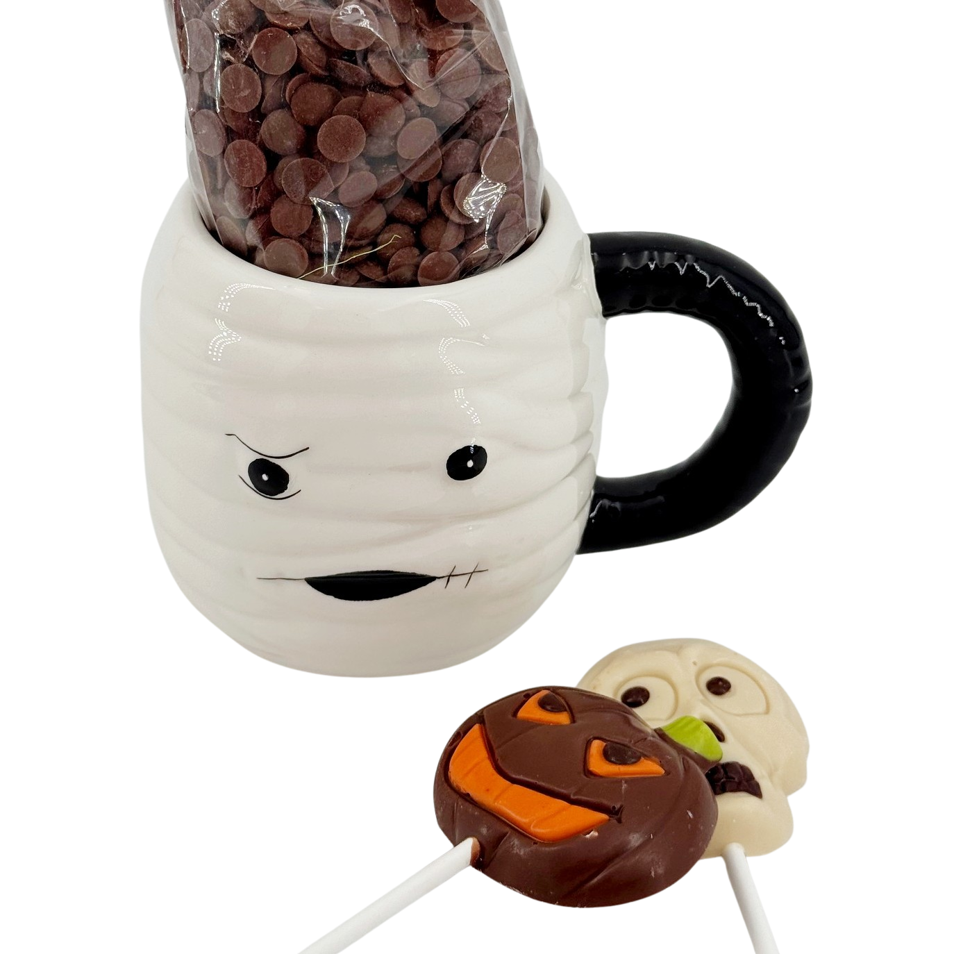 Dark chocolate drops in cup mummy with lollipops