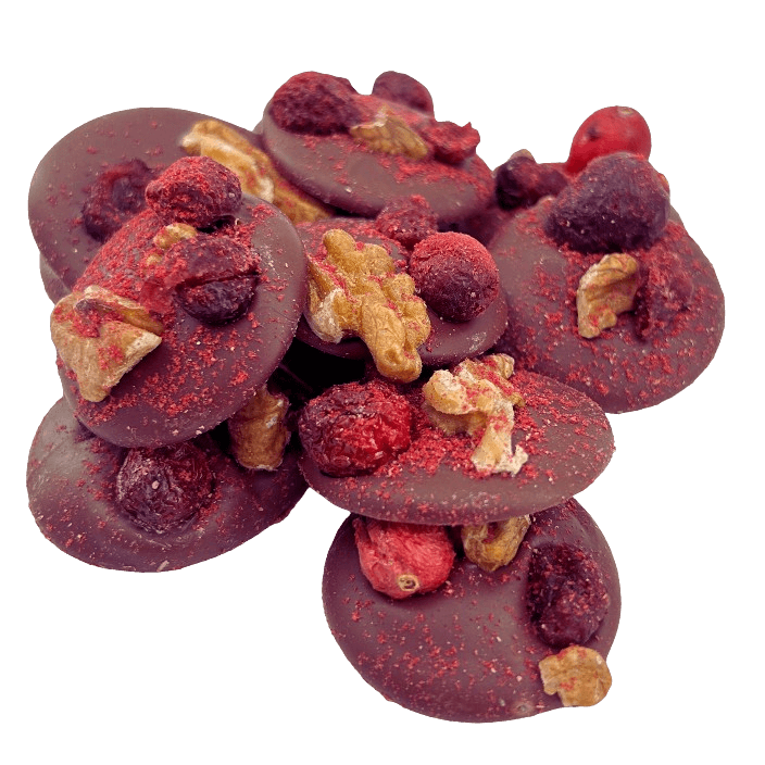 Milk chocolate mendiants with walnut, cranberry, blackcurrant and raspberry pieces