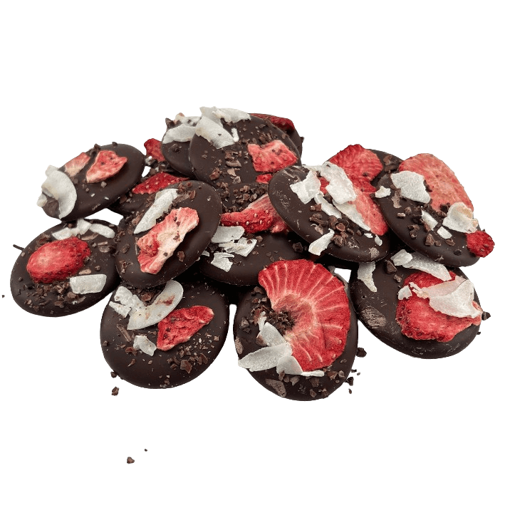Dark chocolate mendiants with cacao nibs, strawberry and coconut pieces