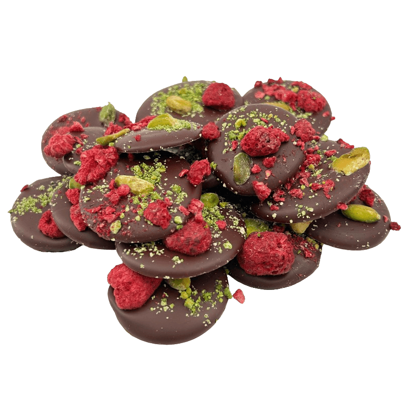 Dark chocolate mendiants with raspberry and pistachio pieces