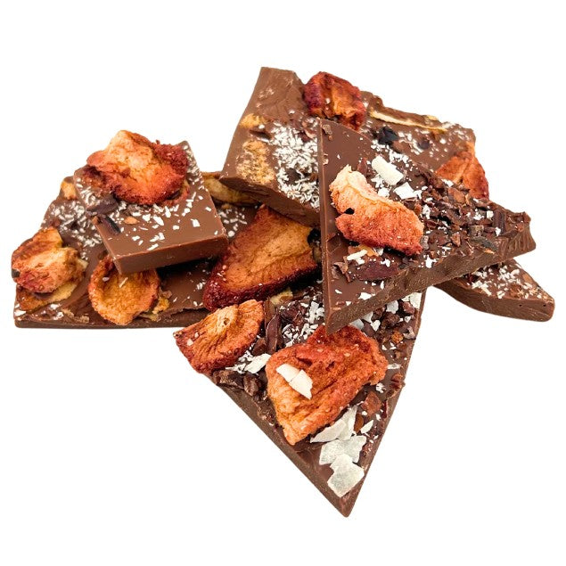 Milk chocolate broken bars with coconut, strawberry, cacao nibs